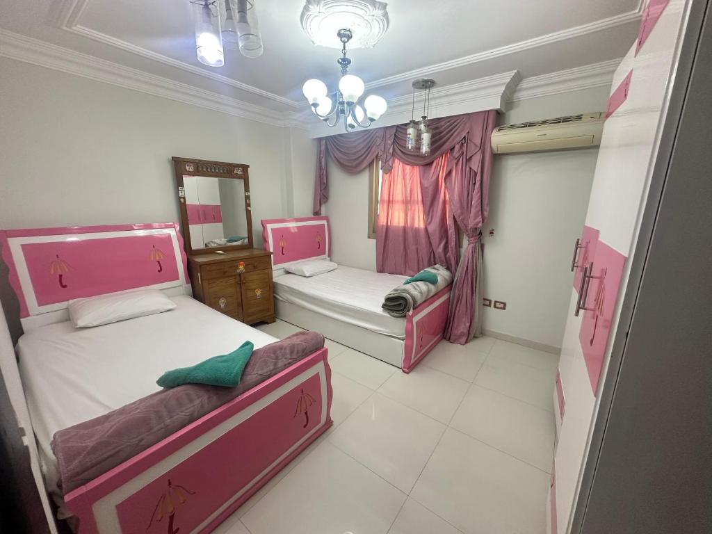 Postel nebo postele na pokoji v ubytování Pharaohs Rooms