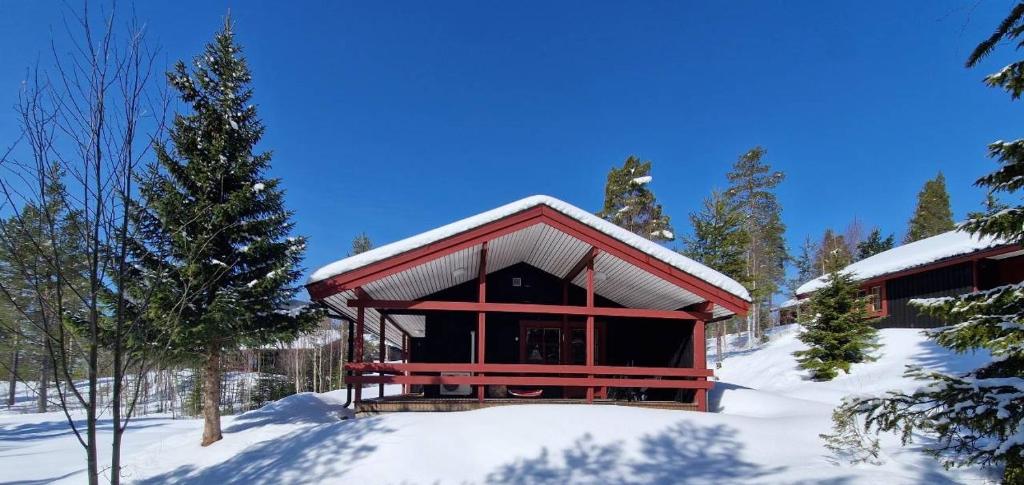 a cabin in the snow with snow on the ground at Sauna | Wi-Fi | Terrace | Wood stove | Cable TV in Lofsdalen