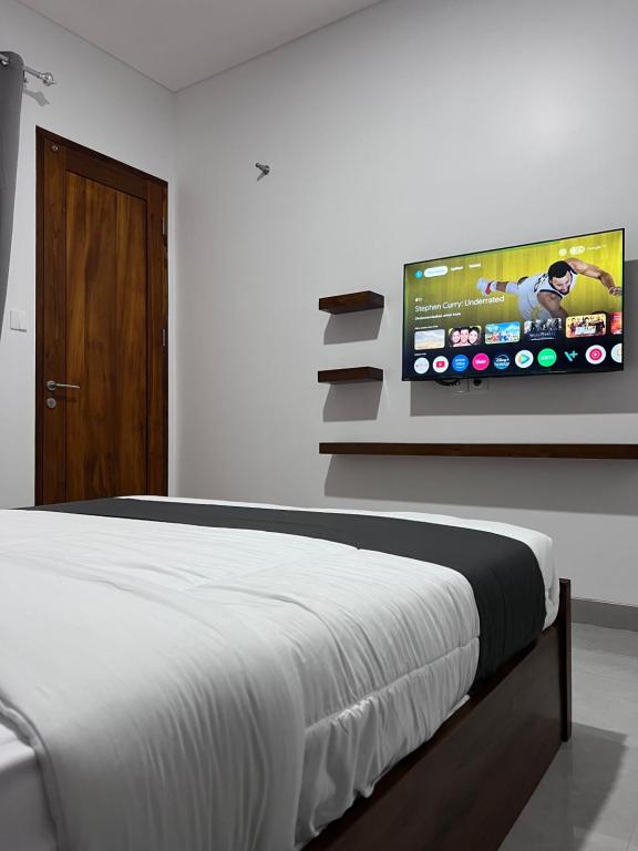 TV a/nebo společenská místnost v ubytování Rauda Living Space Syariah