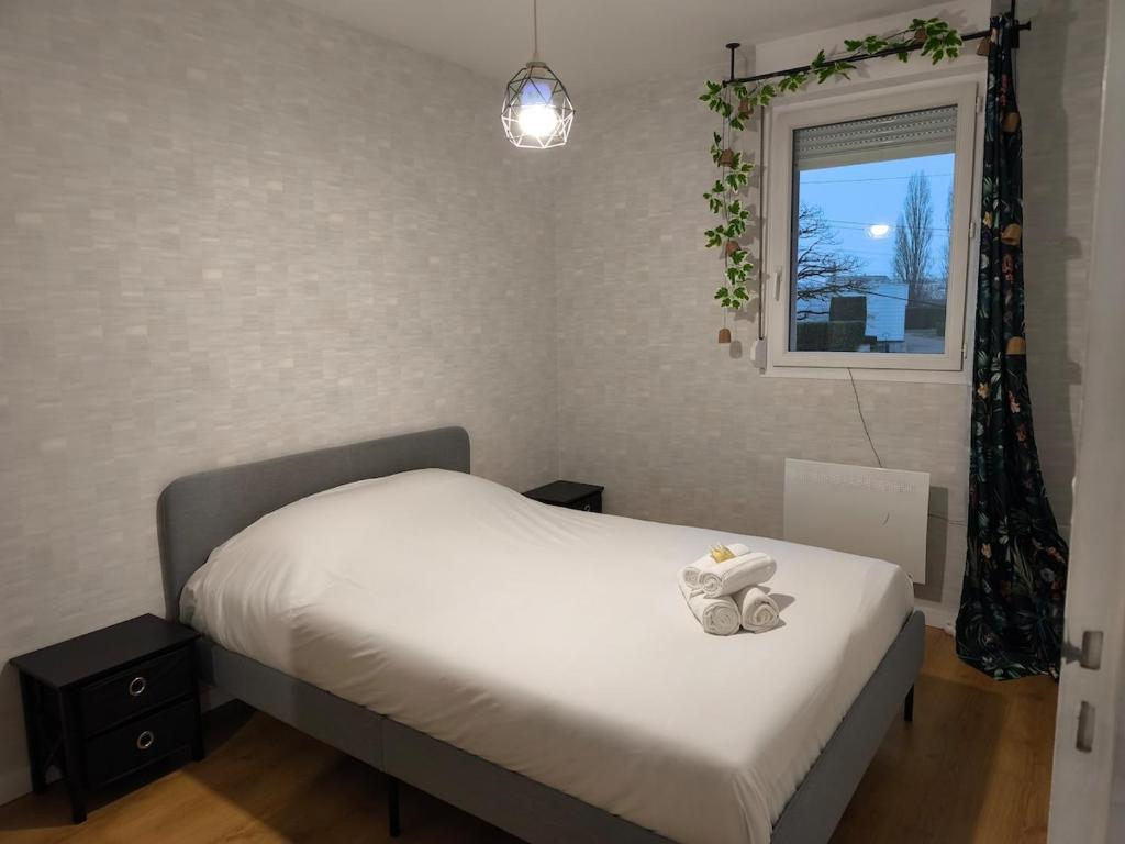 Postel nebo postele na pokoji v ubytování Douce Escale