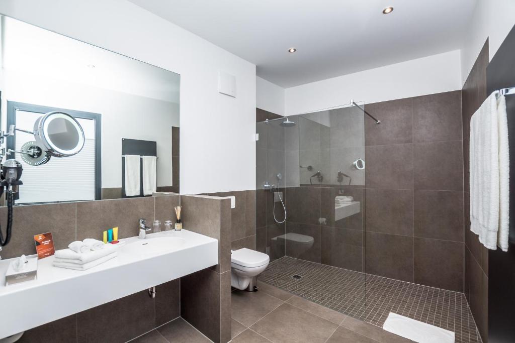 Koupelna v ubytování Stadthotel Reich