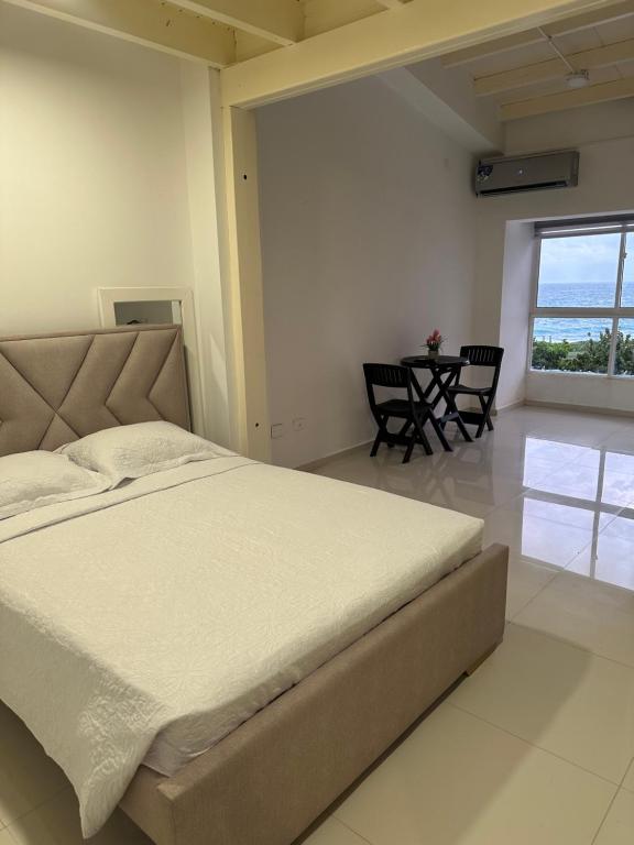 Postel nebo postele na pokoji v ubytování Jhonny Cay Collection Apartahotel