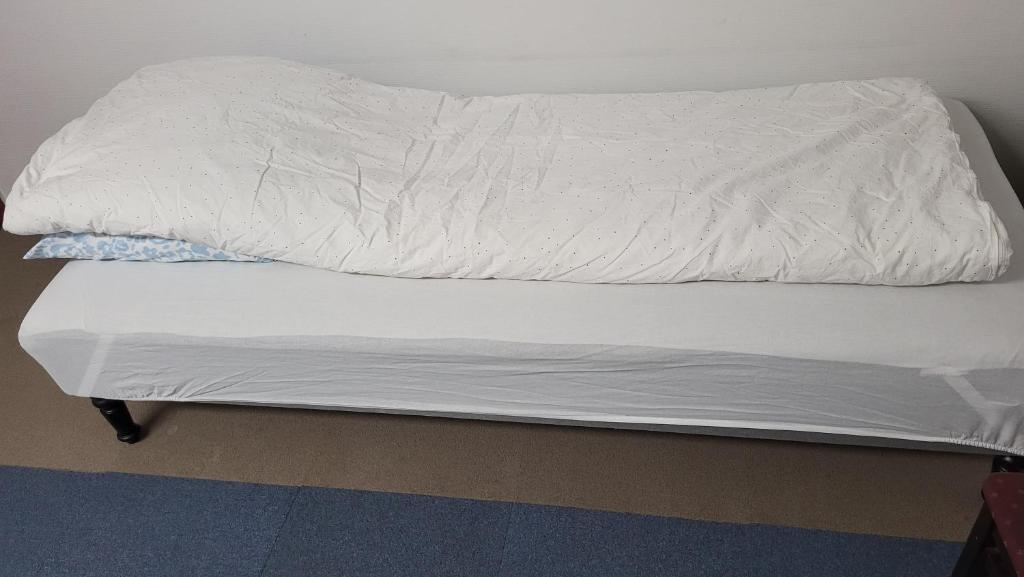Voodi või voodid majutusasutuse Budget Rooms Copenhagen toas