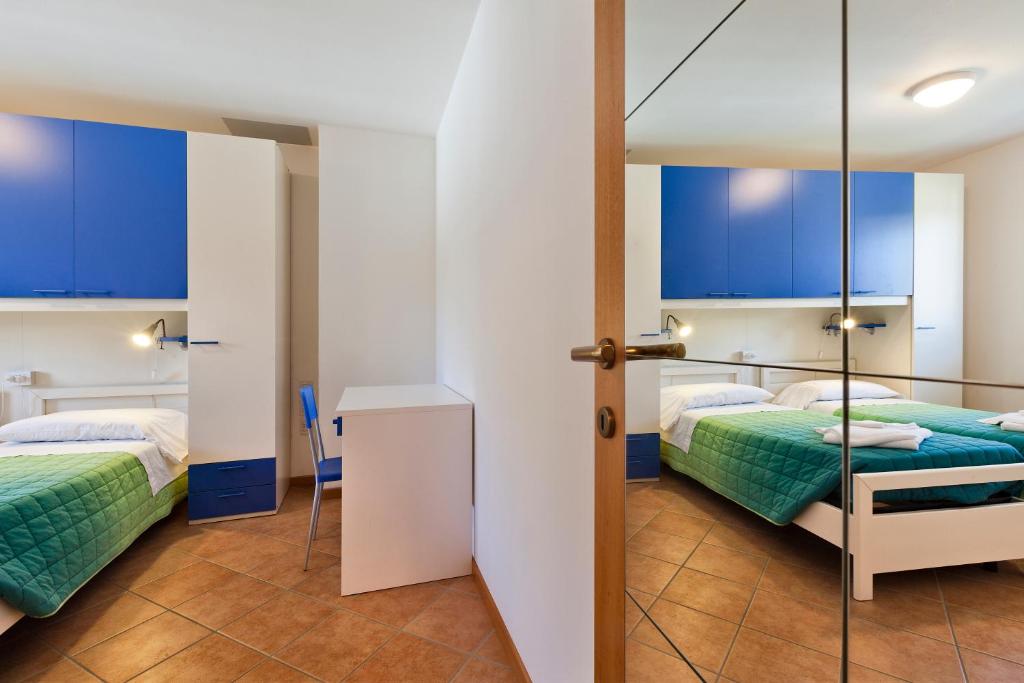 Letto o letti in una camera di Albergo Diffuso Sutrio Zoncolan