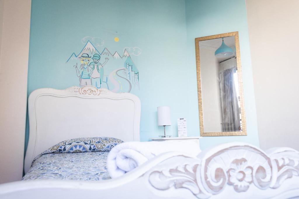 Postel nebo postele na pokoji v ubytování Hostal Providencia