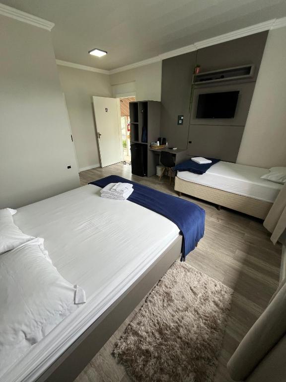 Postel nebo postele na pokoji v ubytování Pousada Kaki Haus