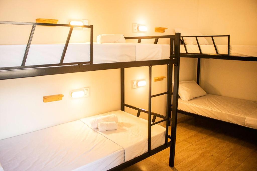 Postel nebo postele na pokoji v ubytování Grand'Hostel