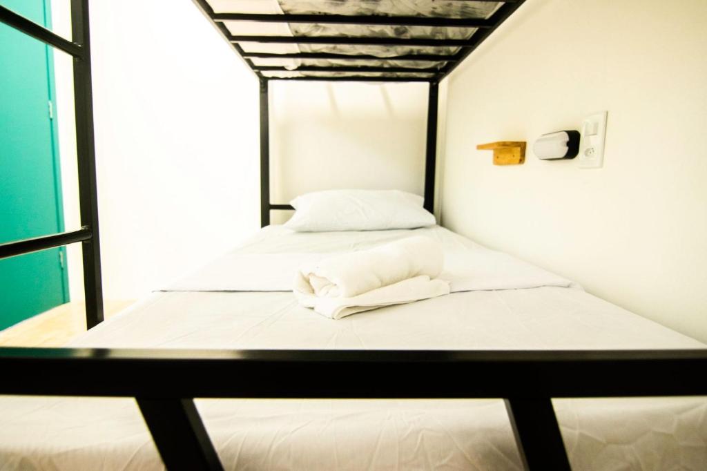 Postel nebo postele na pokoji v ubytování Grand'Hostel