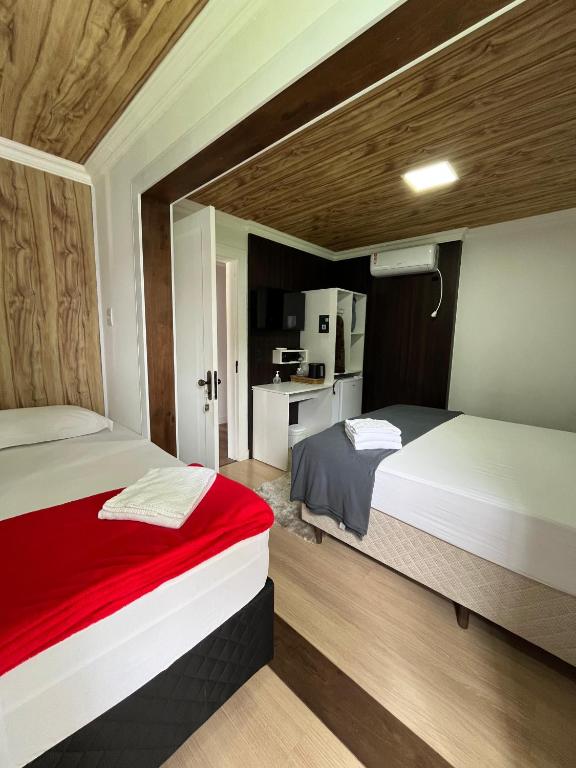 Postel nebo postele na pokoji v ubytování Pousada Kaki Haus