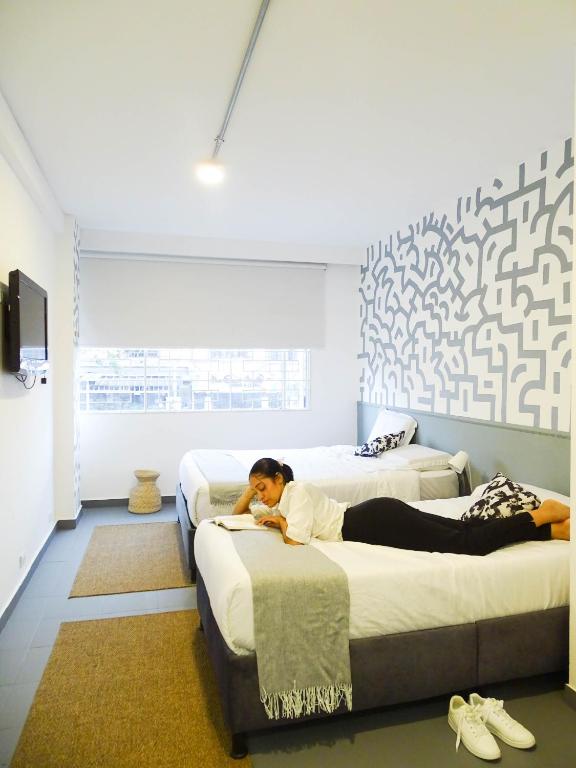 Postel nebo postele na pokoji v ubytování Nomadia Coliving Boutique