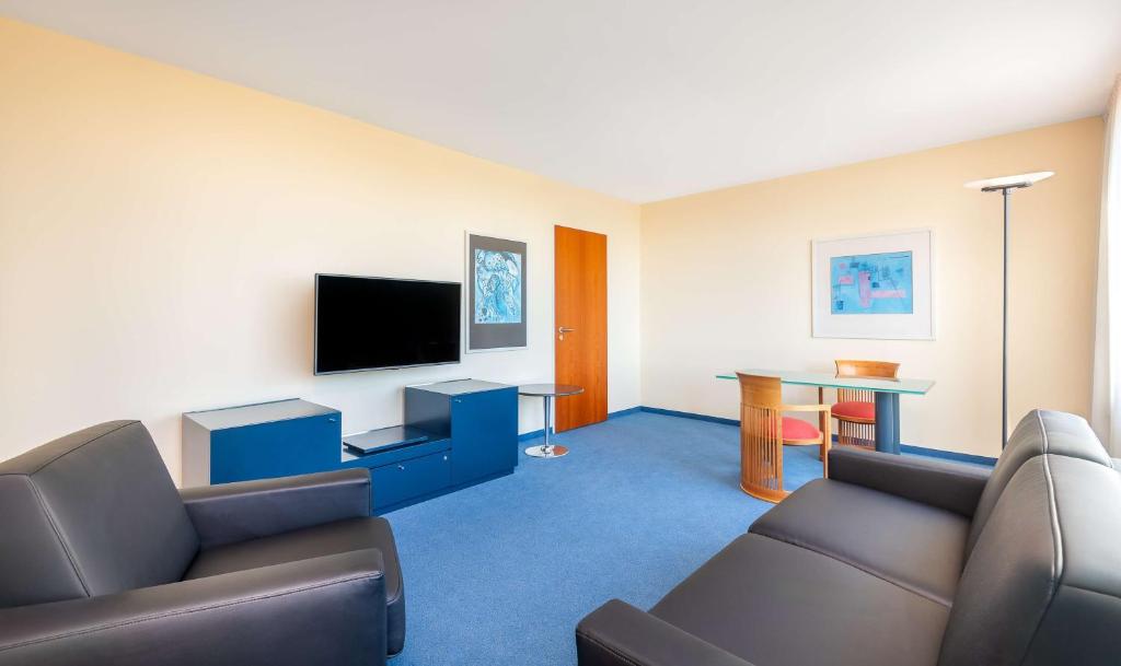 TV a/nebo společenská místnost v ubytování Radisson Blu Fürst Leopold Hotel