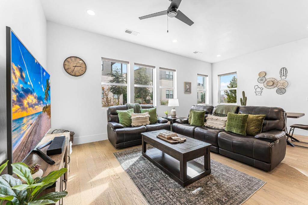 a living room with a couch and a table at Villa #18 at Bloomington Country Club townhouse in St. George