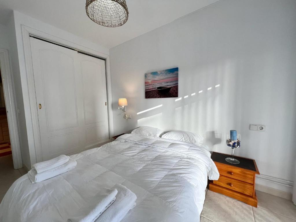 Postel nebo postele na pokoji v ubytování Cozy apartment on the beach of Calpe