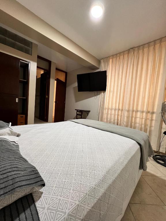 Postel nebo postele na pokoji v ubytování Hostal Borsalino