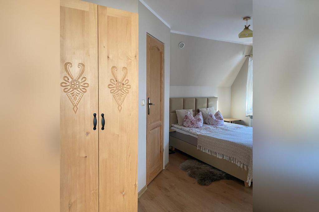 Posteľ alebo postele v izbe v ubytovaní Apartamenty nad Potokiem Aneta Burliga