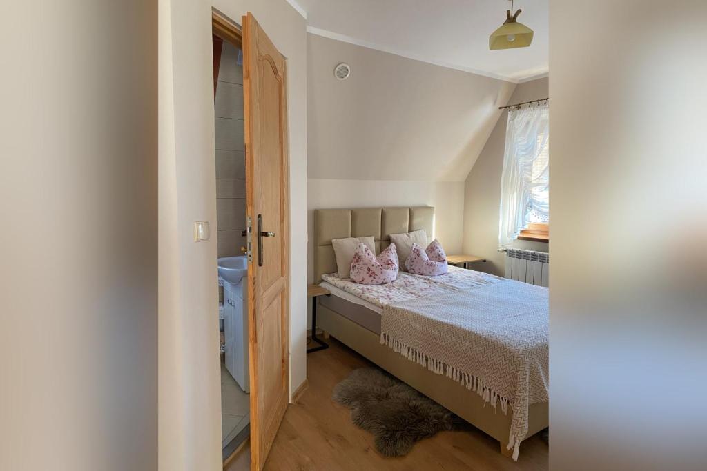 Posteľ alebo postele v izbe v ubytovaní Apartamenty nad Potokiem Aneta Burliga