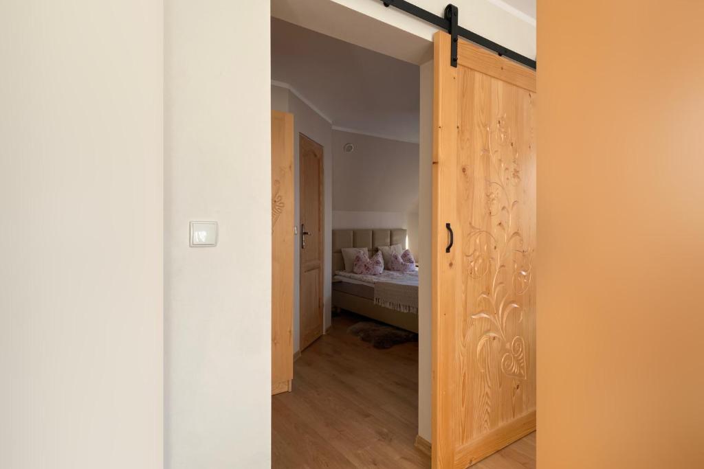 Posteľ alebo postele v izbe v ubytovaní Apartamenty nad Potokiem Aneta Burliga