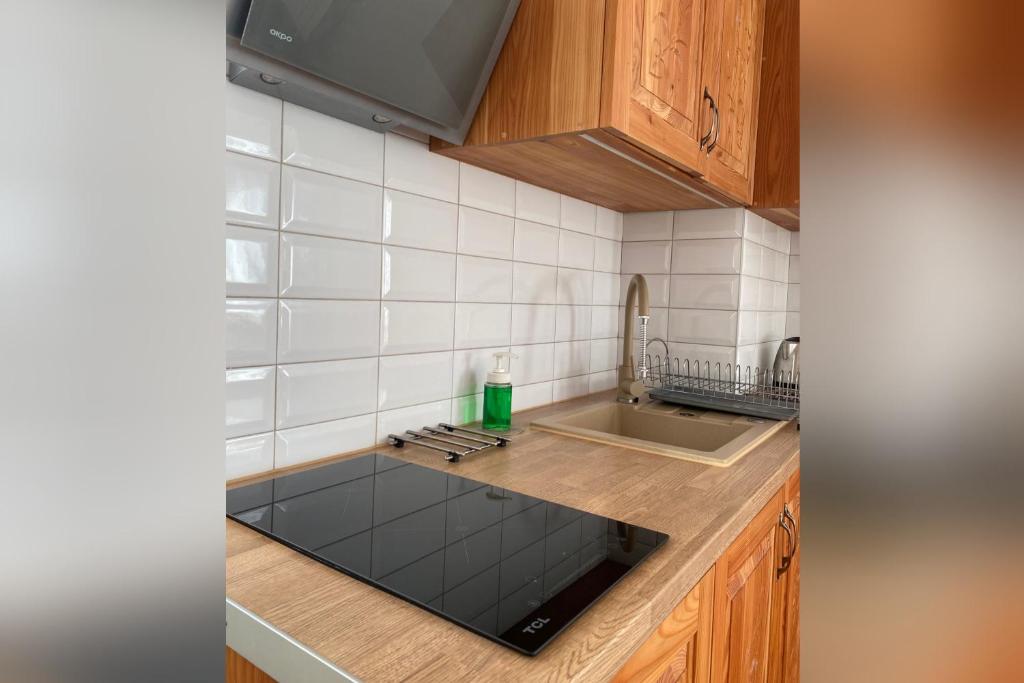 Kuchyňa alebo kuchynka v ubytovaní Apartamenty nad Potokiem Aneta Burliga