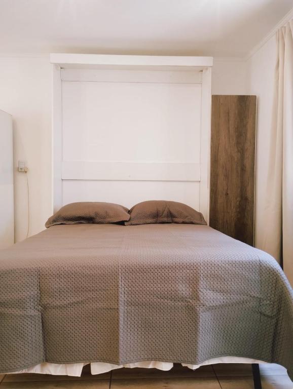 Una cama o camas en una habitación de Atlántida A 700 m del Mar Santa Clara del Mar