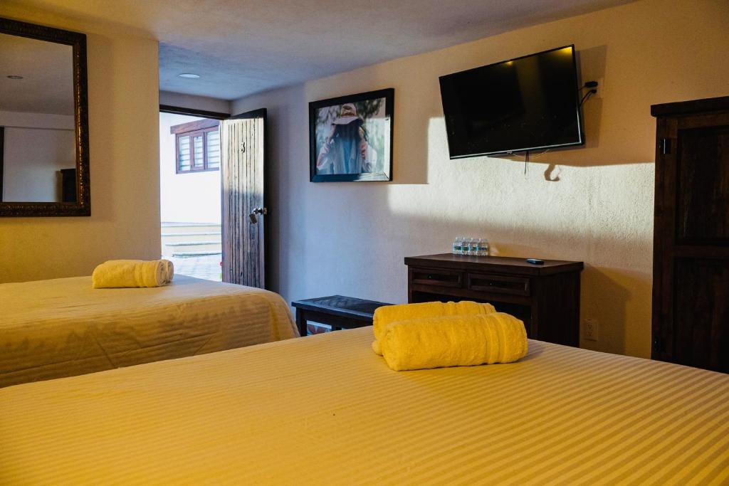 Letto o letti in una camera di Hotel Estancia 1928