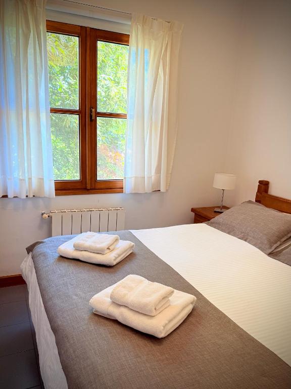 Postel nebo postele na pokoji v ubytování Hostería Bärenhaus