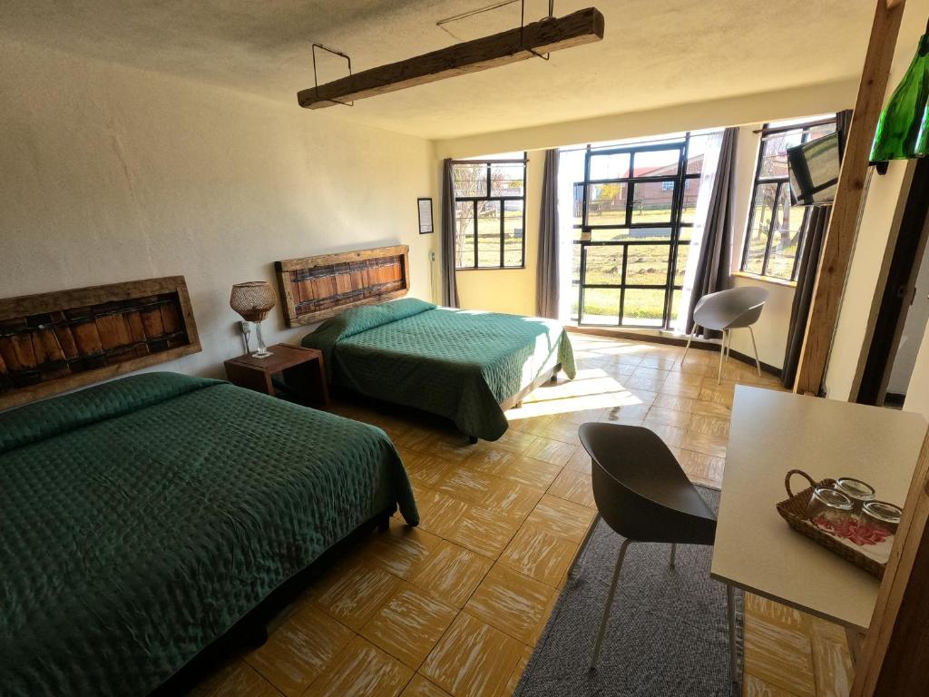 Postel nebo postele na pokoji v ubytování Finca del Pomar