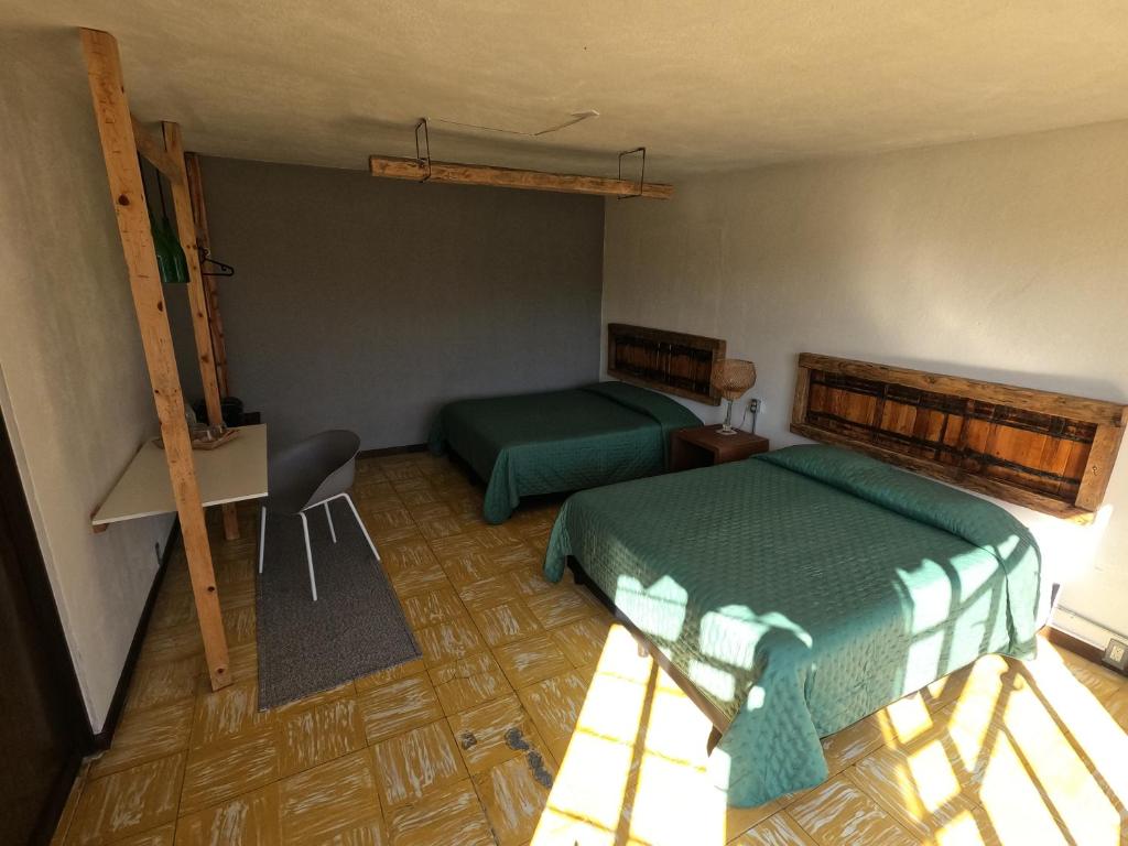 Postel nebo postele na pokoji v ubytování Finca del Pomar