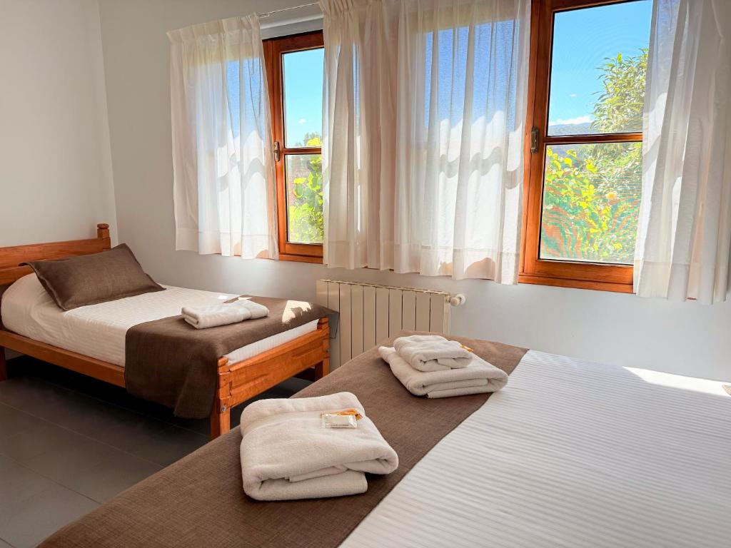 Postel nebo postele na pokoji v ubytování Hostería Bärenhaus