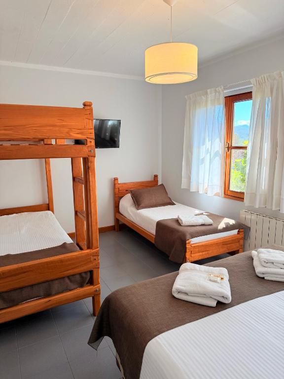 Postel nebo postele na pokoji v ubytování Hostería Bärenhaus