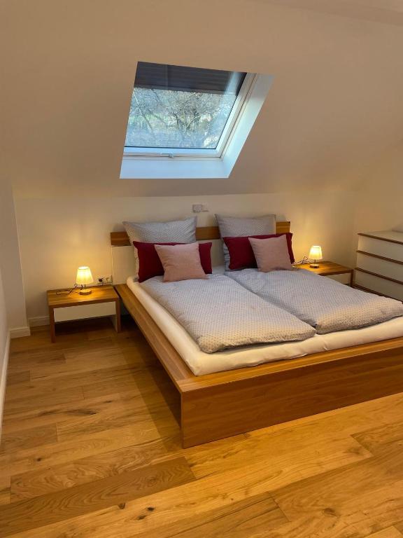 a bedroom with a large bed with two lamps at Kleine Auszeit in Bad Driburg