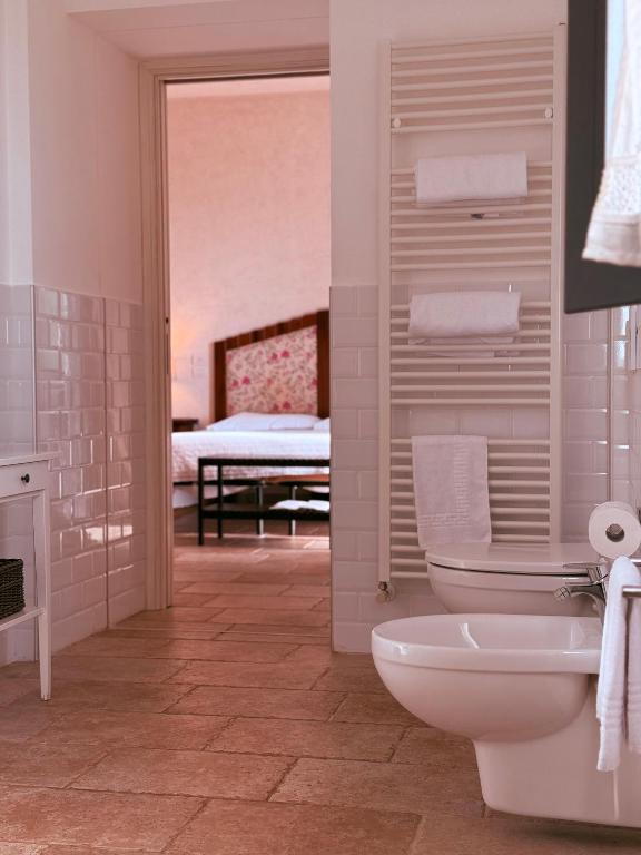 Łóżko lub łóżka w pokoju w obiekcie Masseria Sacramento