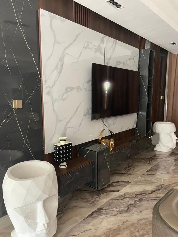 TV a/nebo společenská místnost v ubytování Sujimoto Residences MacDonald