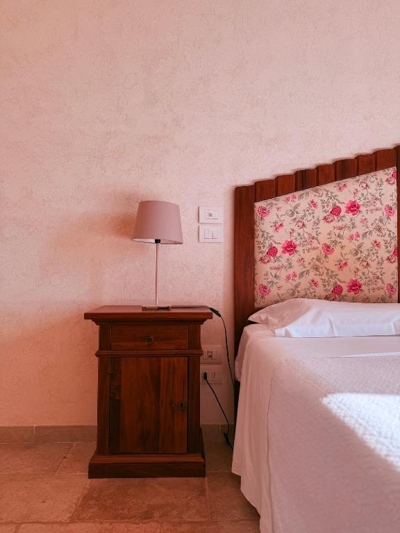Łóżko lub łóżka w pokoju w obiekcie Masseria Sacramento