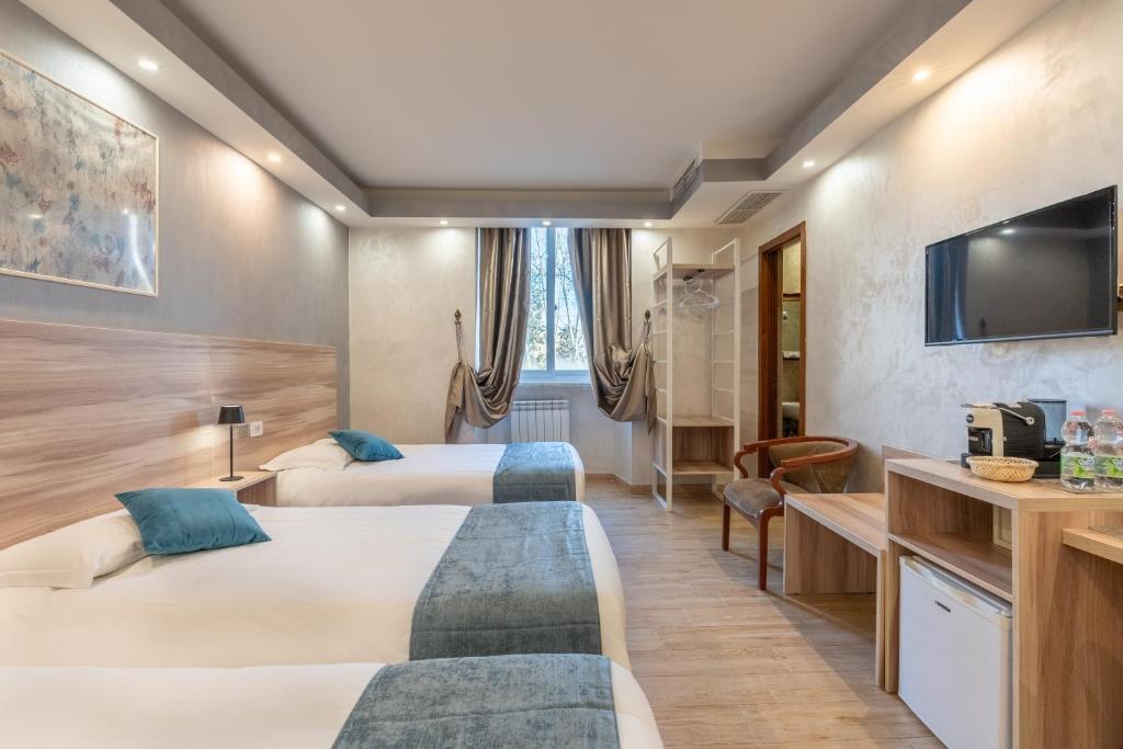 Postel nebo postele na pokoji v ubytování Rome Love Hotel
