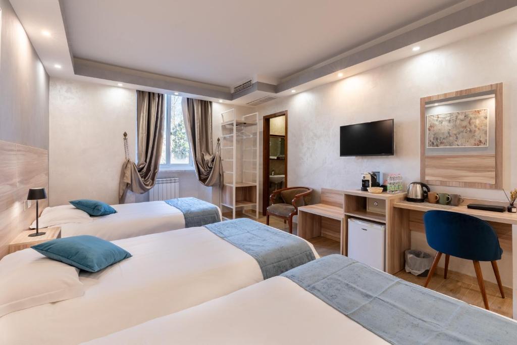 Postel nebo postele na pokoji v ubytování Rome Love Hotel