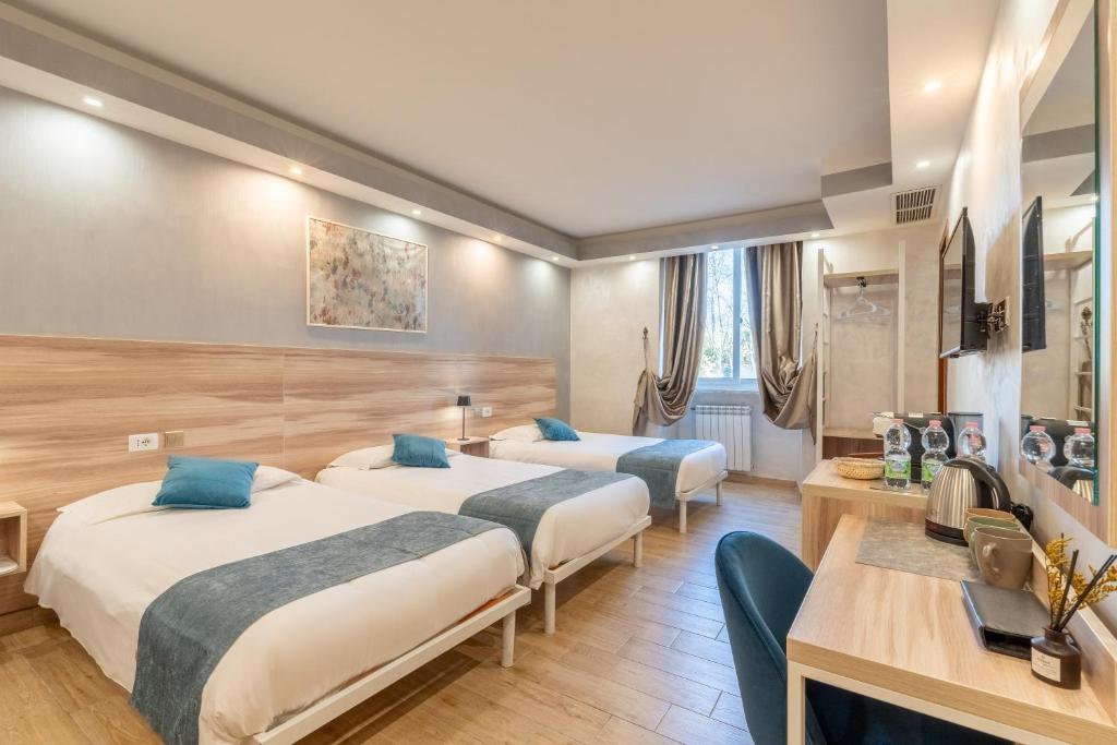 Postel nebo postele na pokoji v ubytování Rome Love Hotel
