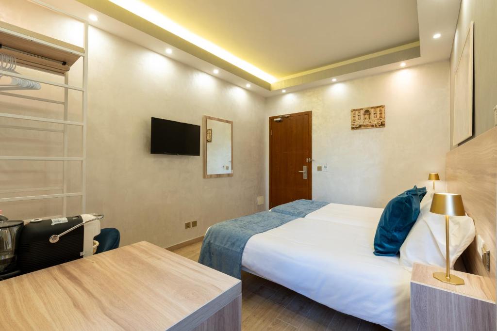 Postel nebo postele na pokoji v ubytování Rome Love Hotel