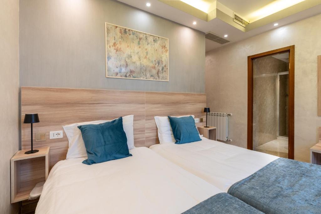 Postel nebo postele na pokoji v ubytování Rome Love Hotel