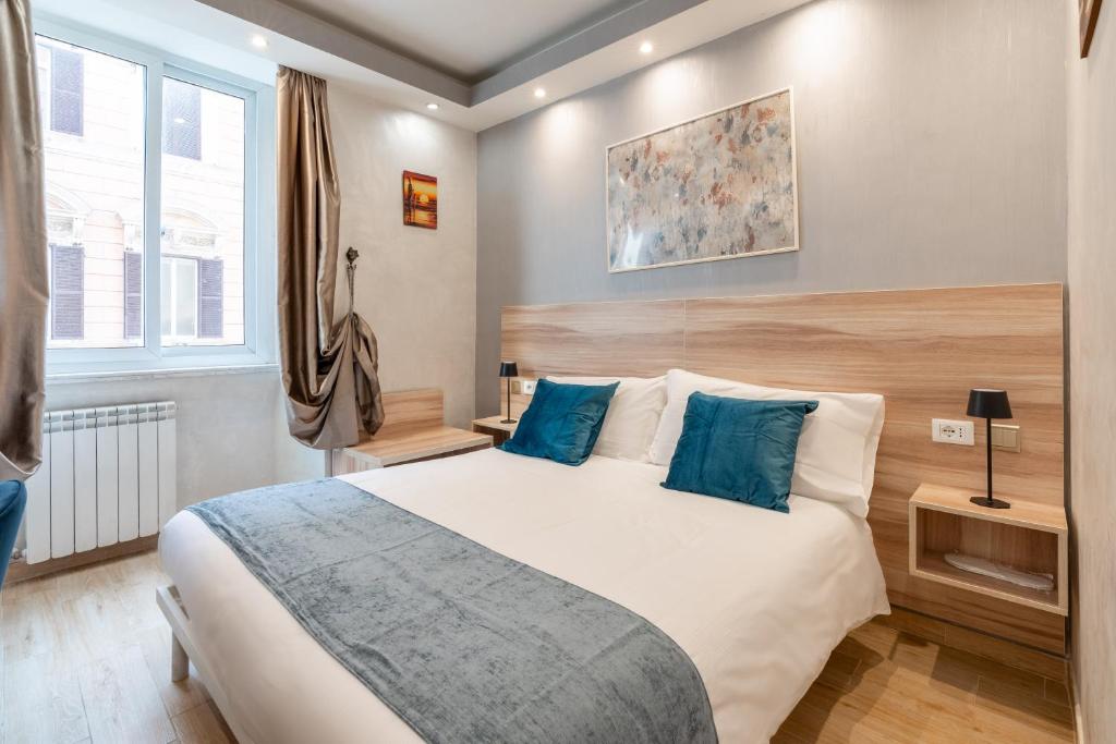 Postel nebo postele na pokoji v ubytování Rome Love Hotel