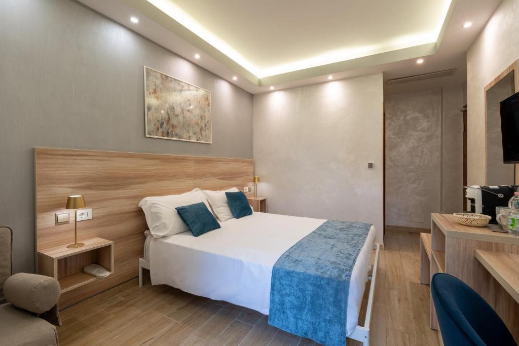 Postel nebo postele na pokoji v ubytování Rome Love Hotel