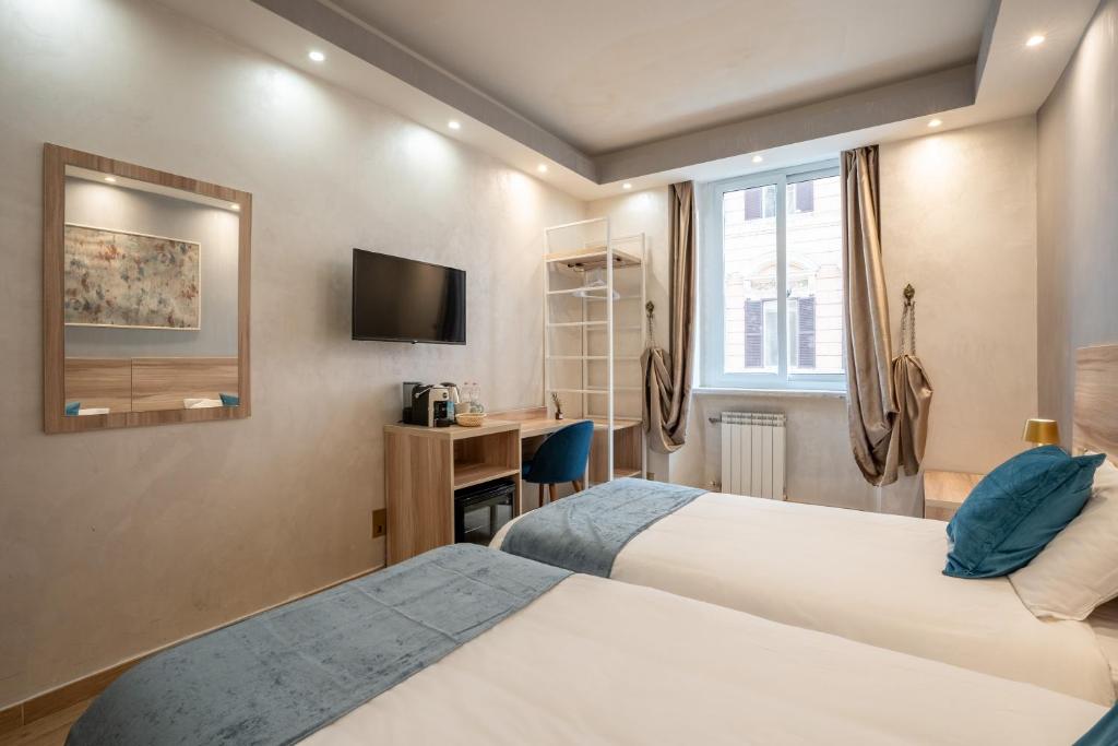 Postel nebo postele na pokoji v ubytování Rome Love Hotel