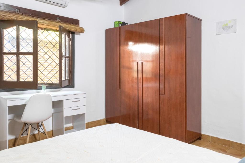 Postel nebo postele na pokoji v ubytování La Luqueña House