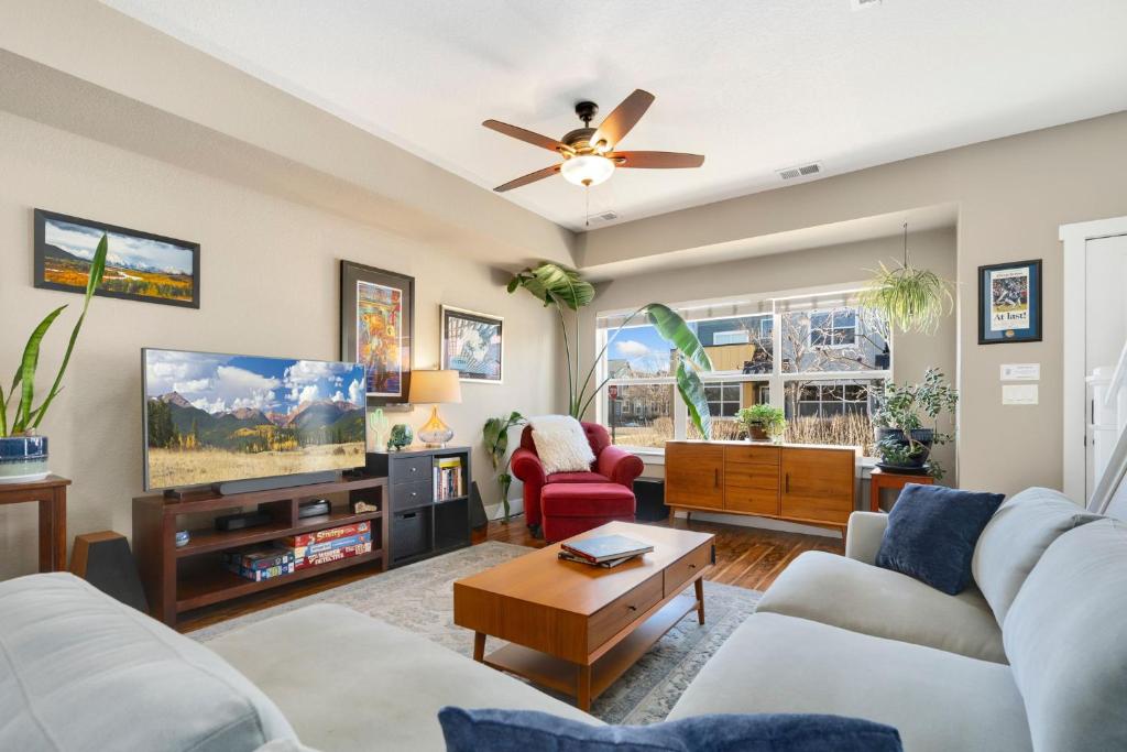a living room with a couch and a tv at Old Town Escape with King Bed, Dog-Friendly in Fort Collins