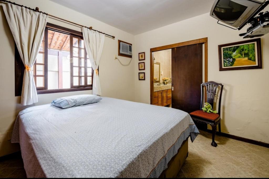 Postel nebo postele na pokoji v ubytování Casa em Jacarepaguá excelente para desfrutar o Rio de Janeiro