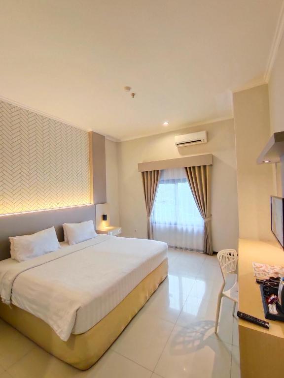 Postel nebo postele na pokoji v ubytování Royal Park Hotel