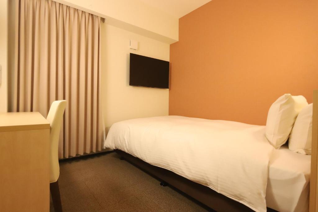 TV a/nebo společenská místnost v ubytování AB Hotel Igaueno