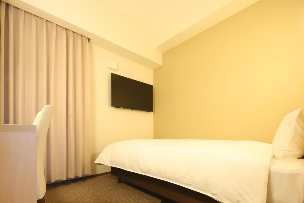 TV a/nebo společenská místnost v ubytování AB Hotel Nakatsugawa