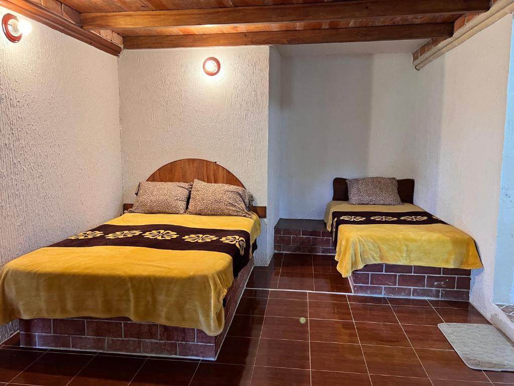 Letto o letti in una camera di Posada Quetzalin