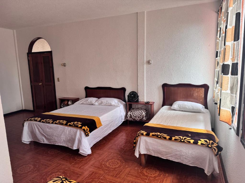 Letto o letti in una camera di Posada Quetzalin