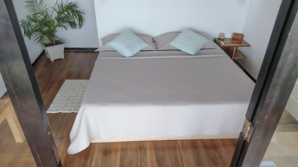 Postel nebo postele na pokoji v ubytování Suite La Isla